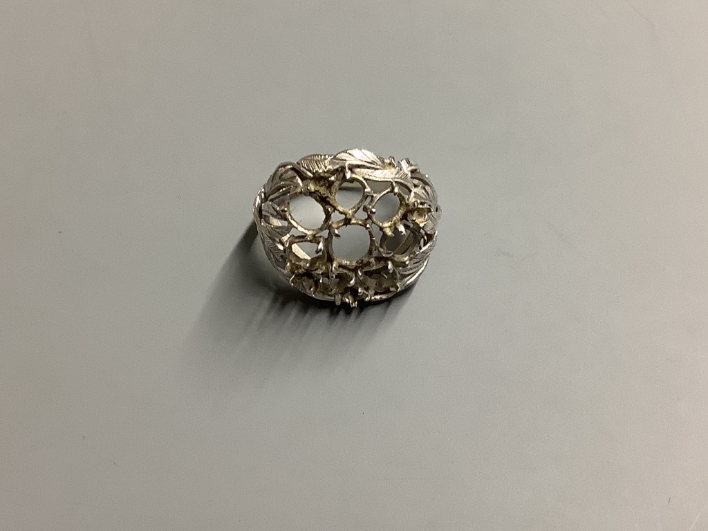 A Japanese 14ct white gold leaf design cluster ring setting (stones removed), 5.8 grams.